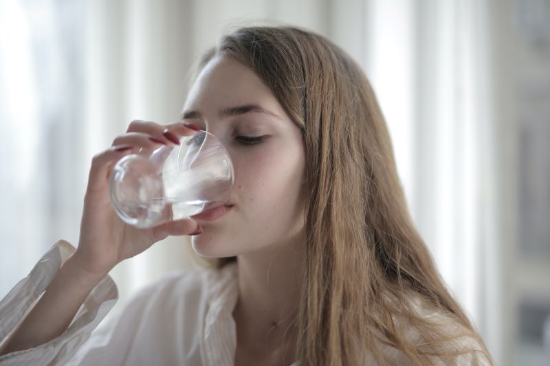 A girl Drinking a glass of water