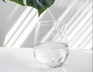 drinking water in a glass
