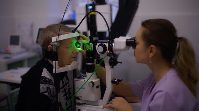 optometrist checking eyes